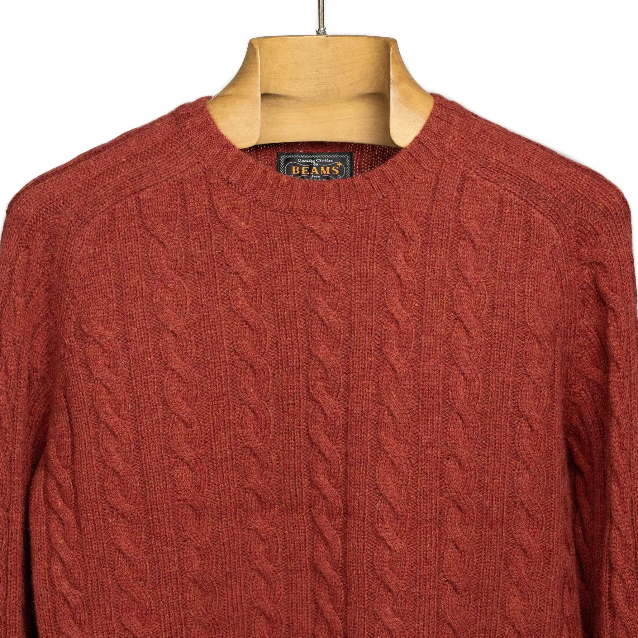 Cable crewneck sweater in brick red wool