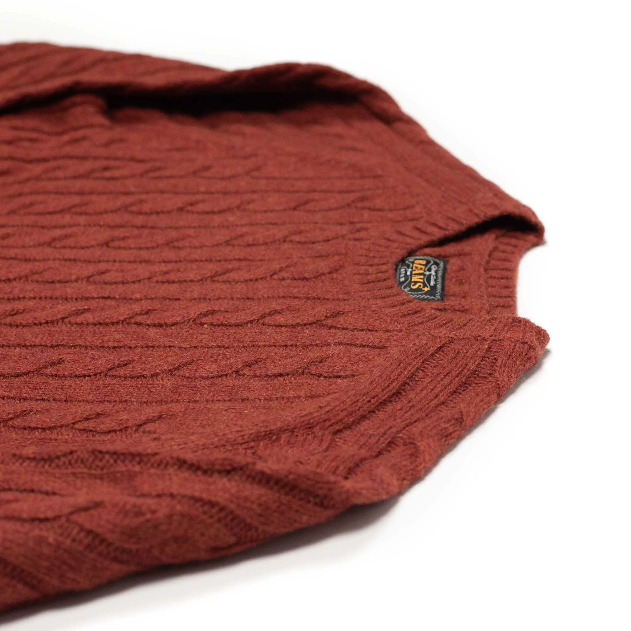 Cable crewneck sweater in brick red wool