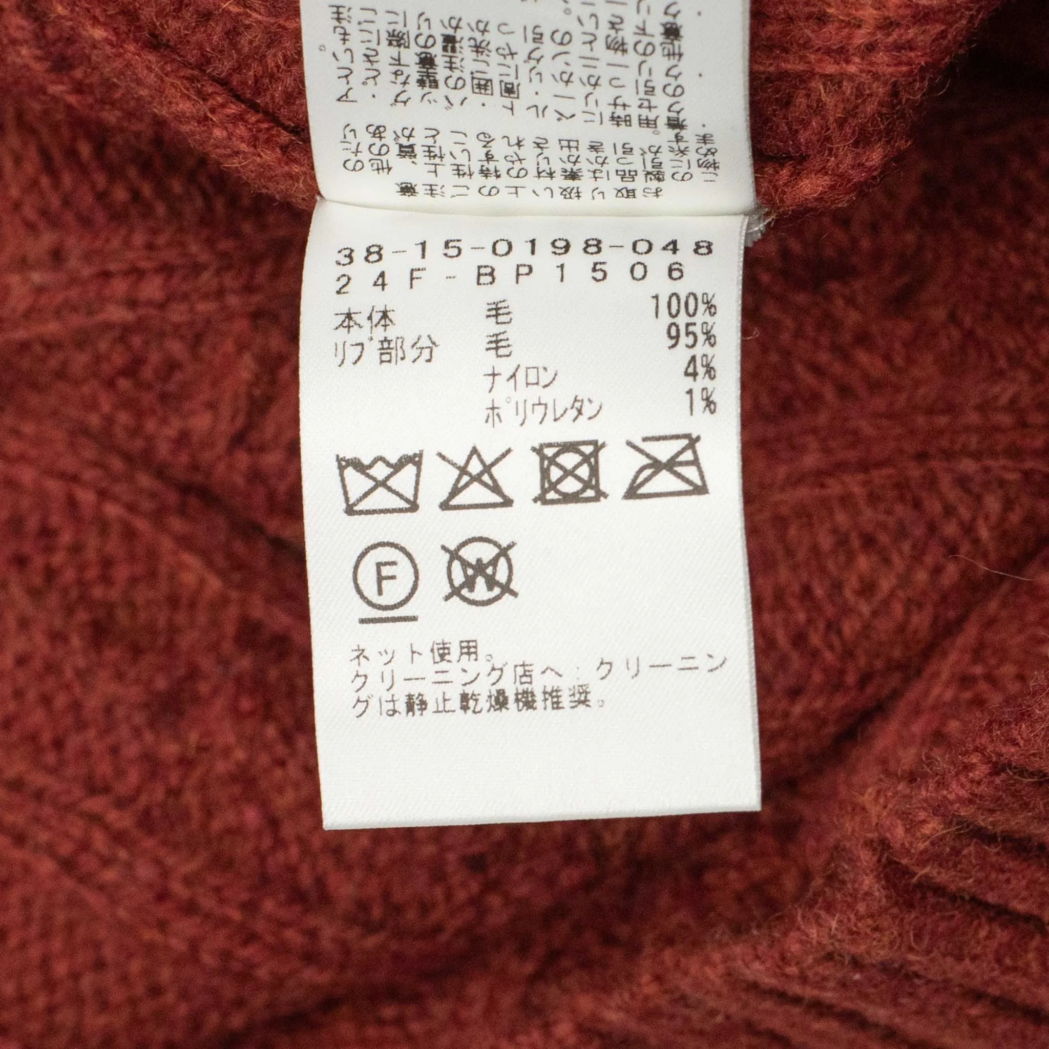 Cable crewneck sweater in brick red wool